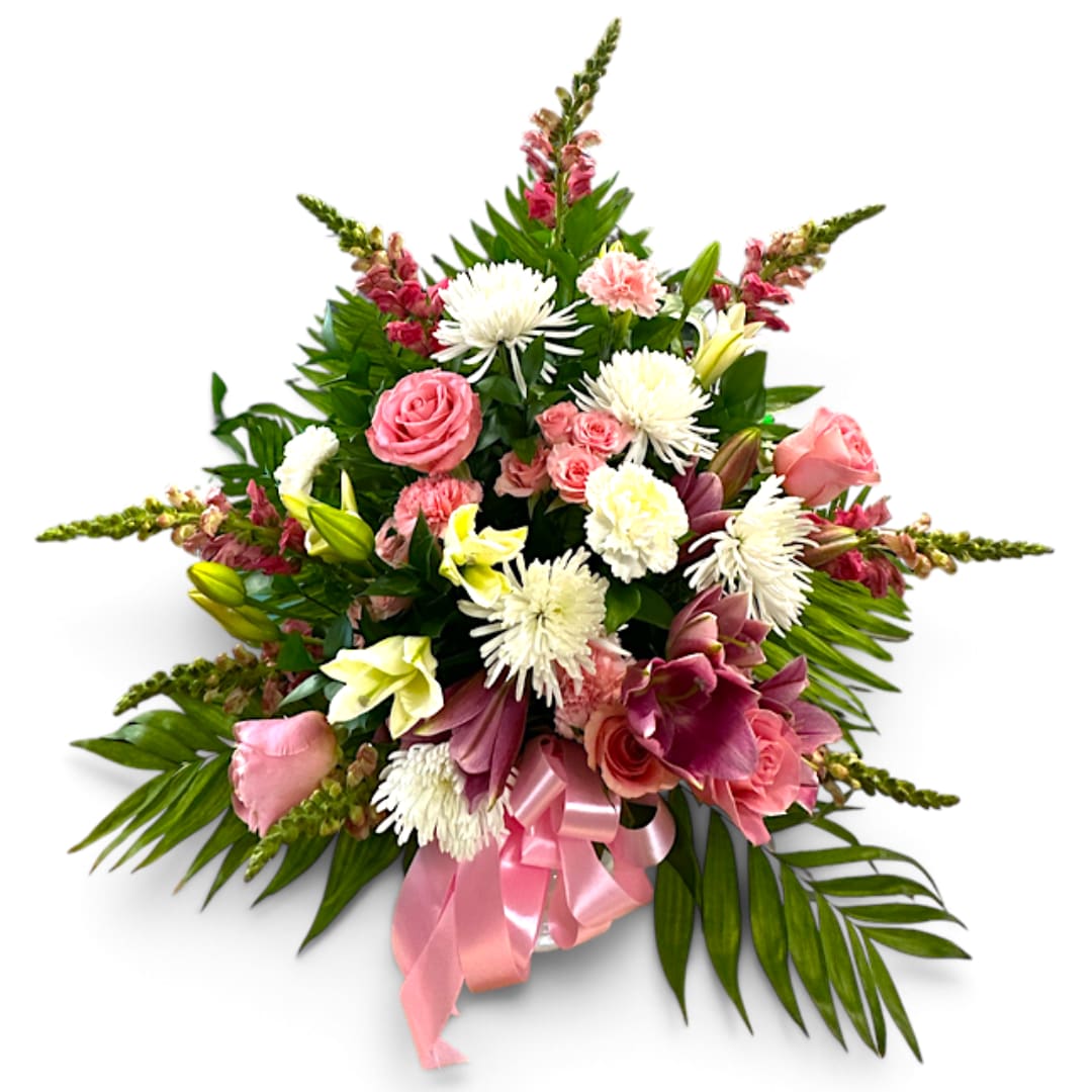 Pink and white mixed flower arrangement with a pink ribbon