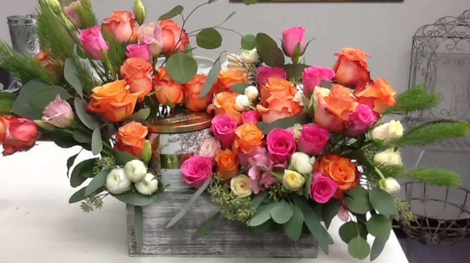 Color Me Beautiful - Celebrate your special occasion with this bold, bright beautiful flower arrangement in a gift box with candle. 