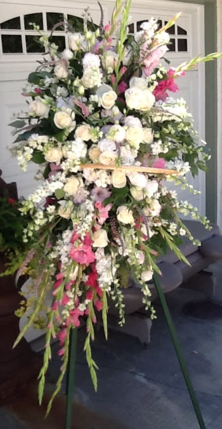 Large standing floral spray with white and pink flowers