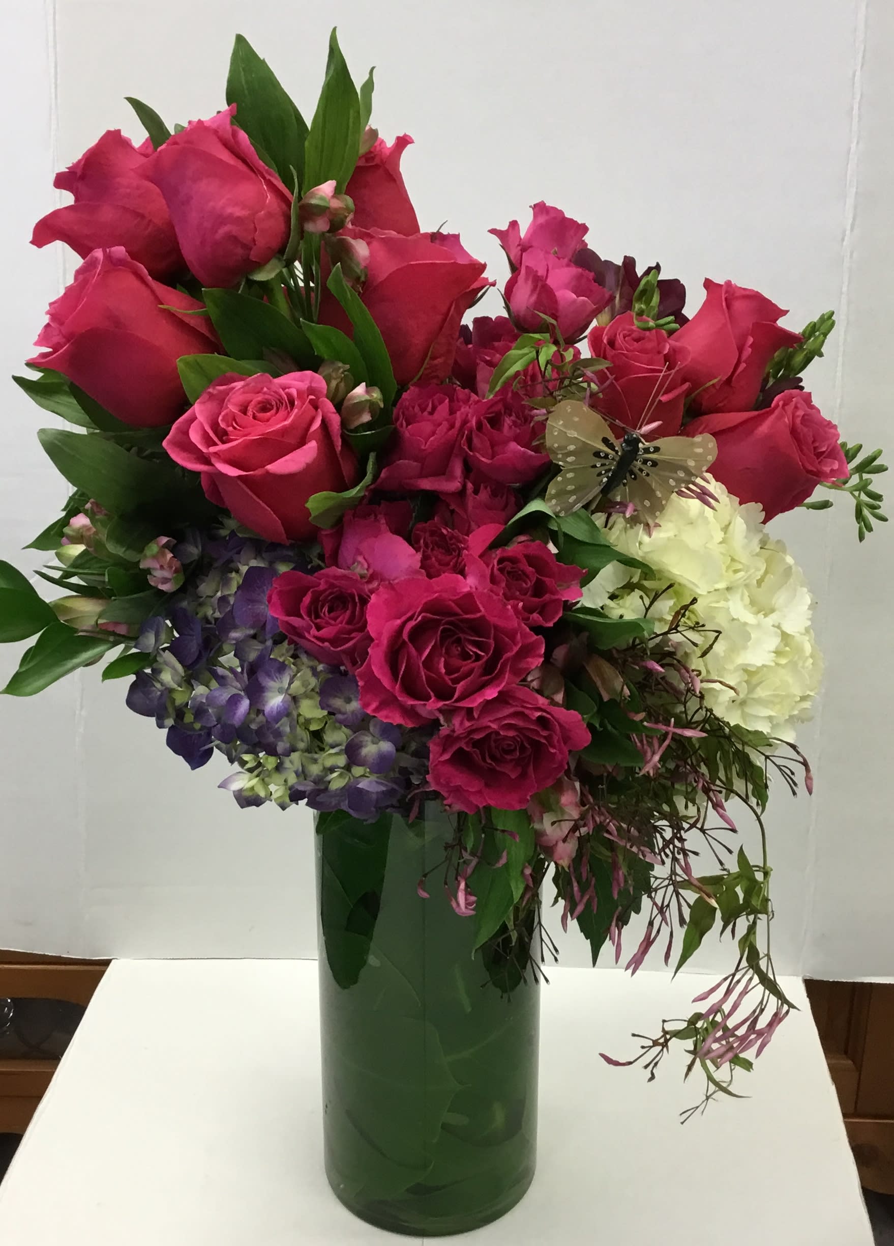 Butterfly Kiss - Say “I love and appreciate you with this amazing floral arrangement. It is designed with hydrangeas, roses, spray roses, freesia, lisianthus and jasmine.