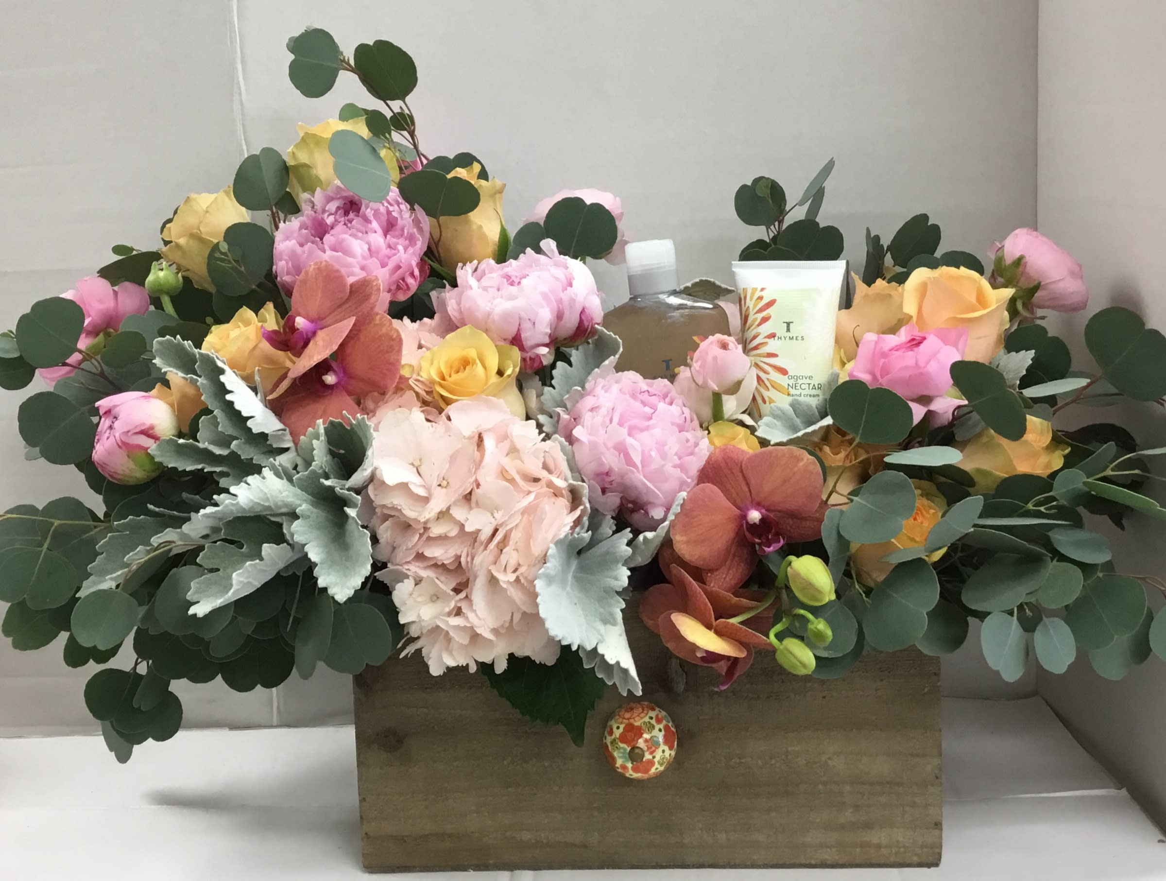 Gift Box For Her/Relax and Unwind - A gift that is sure to be enjoyed. Reusable wood box filled with an abundance of fresh flowers. Also includes bath and shower gel and moisturizing body lotion