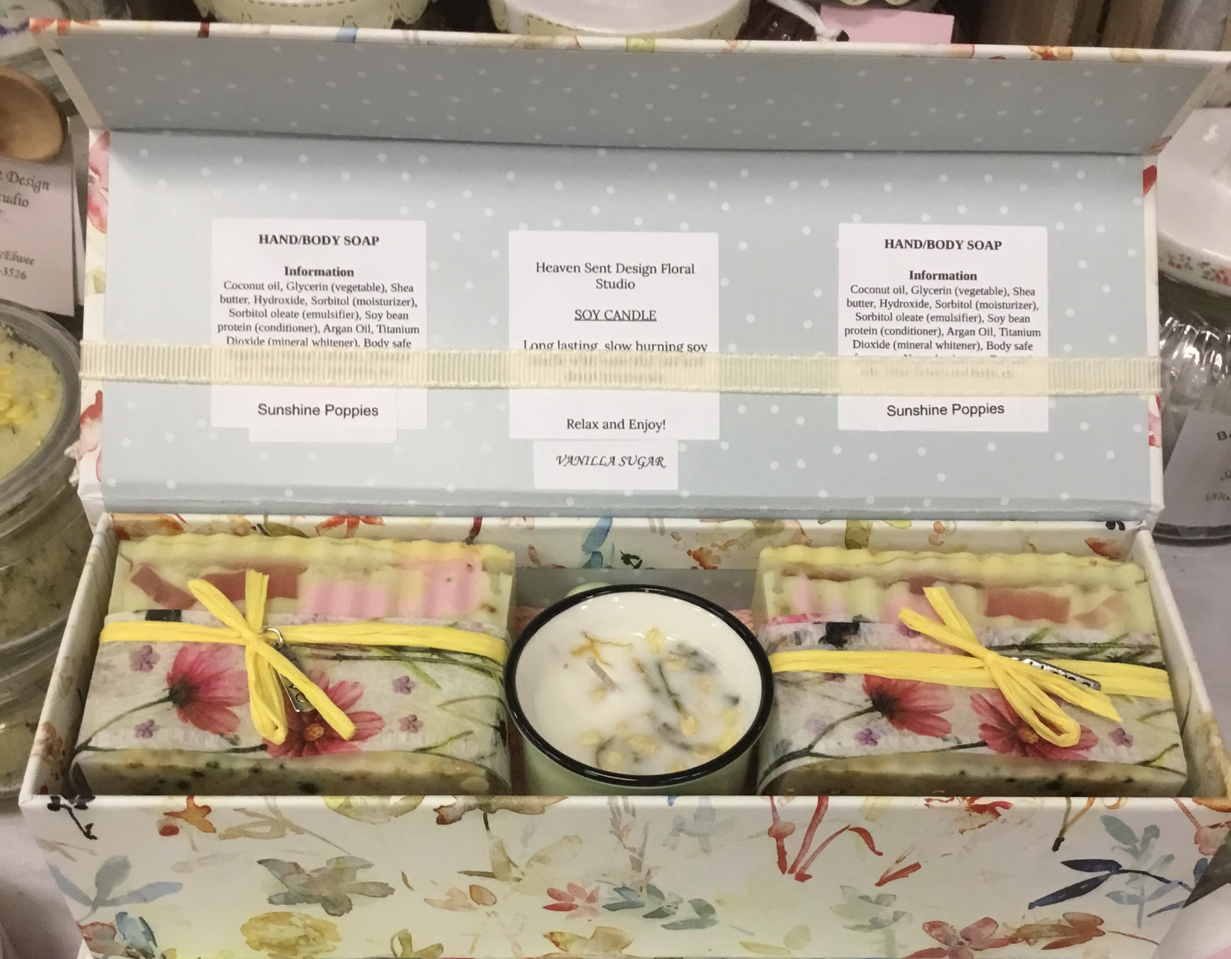 Gift box with floral soap bars and a candle