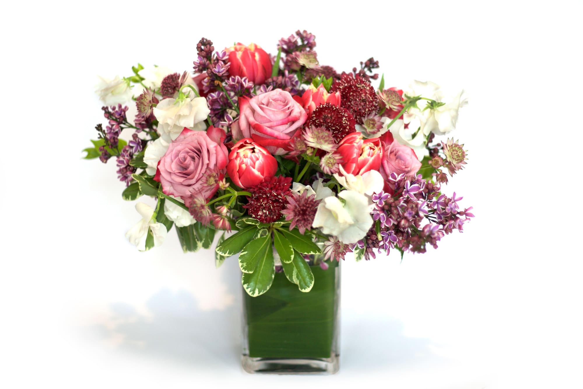 Pink and white mixed bouquet in a clear glass vase