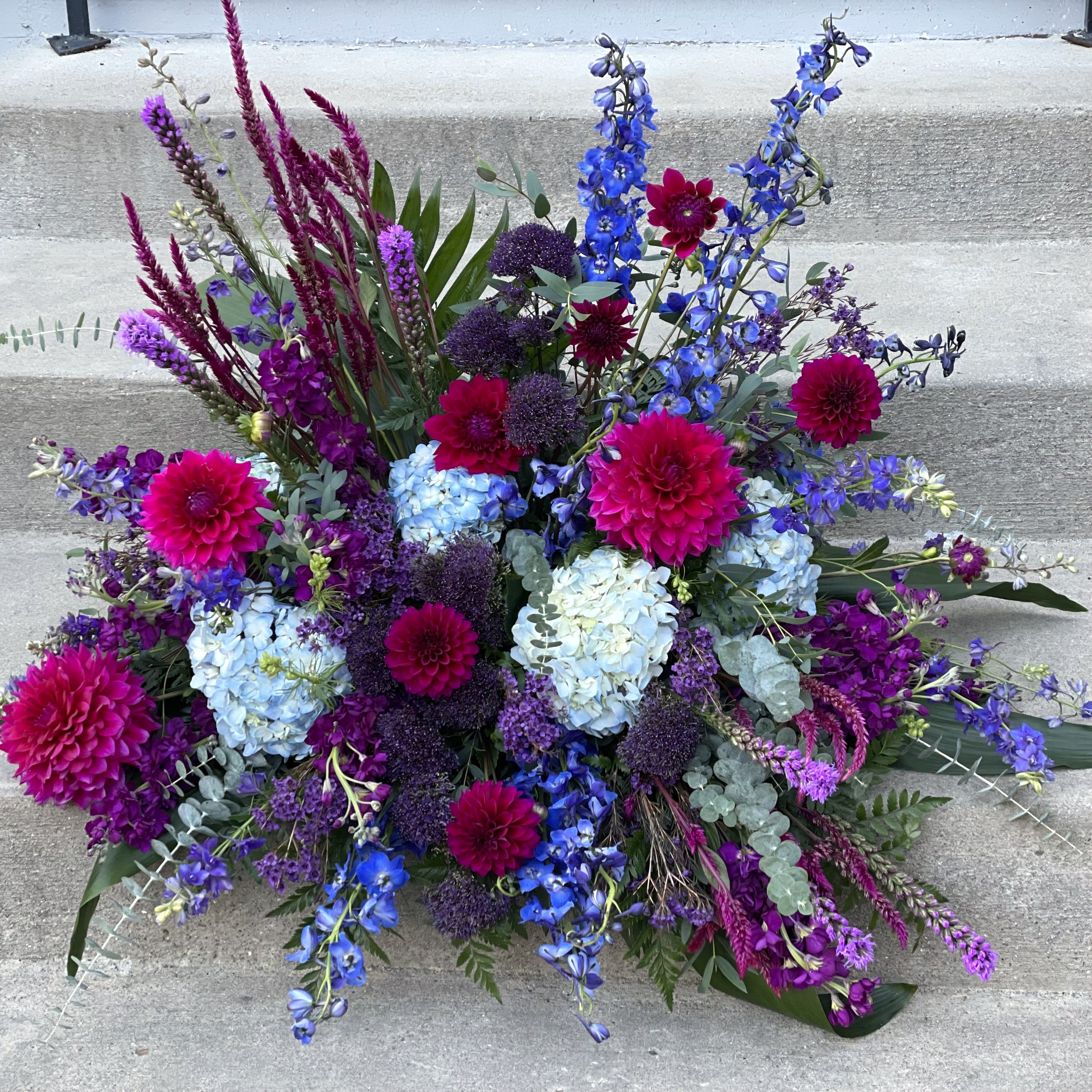 Large bouquet of blue, purple, and pink flowers