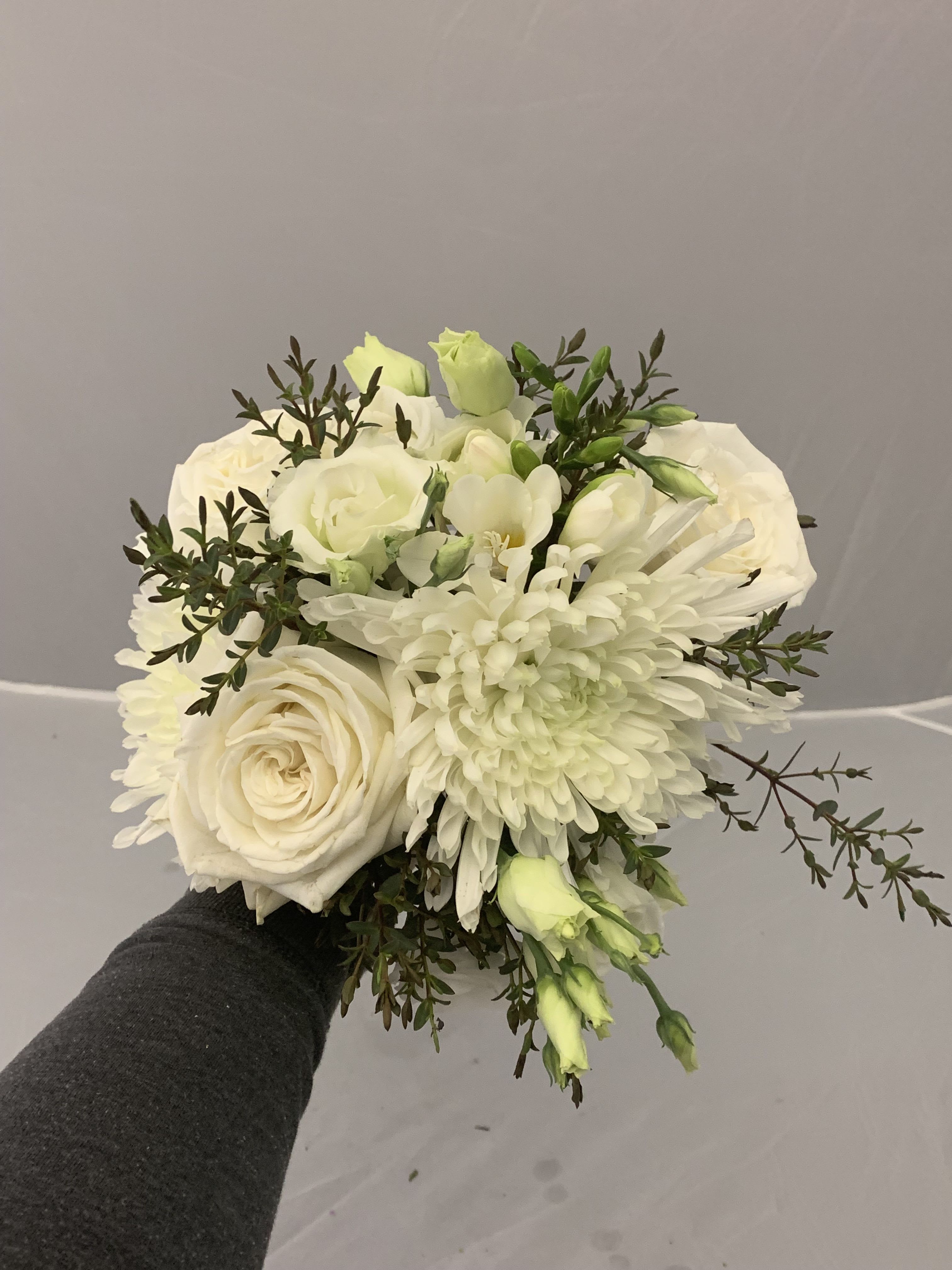 White bouquet with roses, chrysanthemums, and green buds