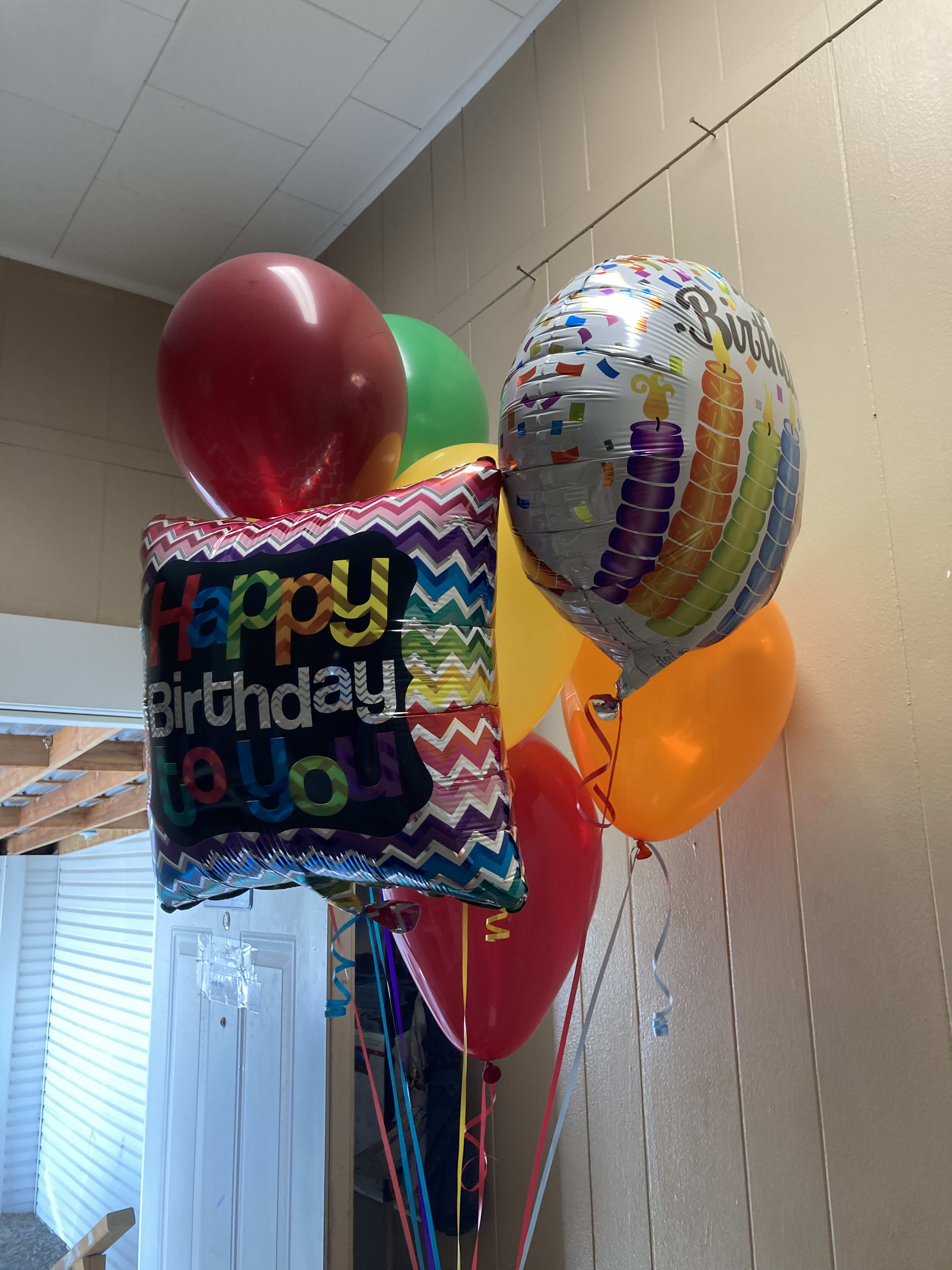 Happy Birthday Bouquet  - A colorful balloon bouquet to celebrate a happy birthday. Two Mylar balloons (designs will vary) and mixed latex balloons with colorful ribbons. Note: Latex balloons stay up only 24 hrs. 