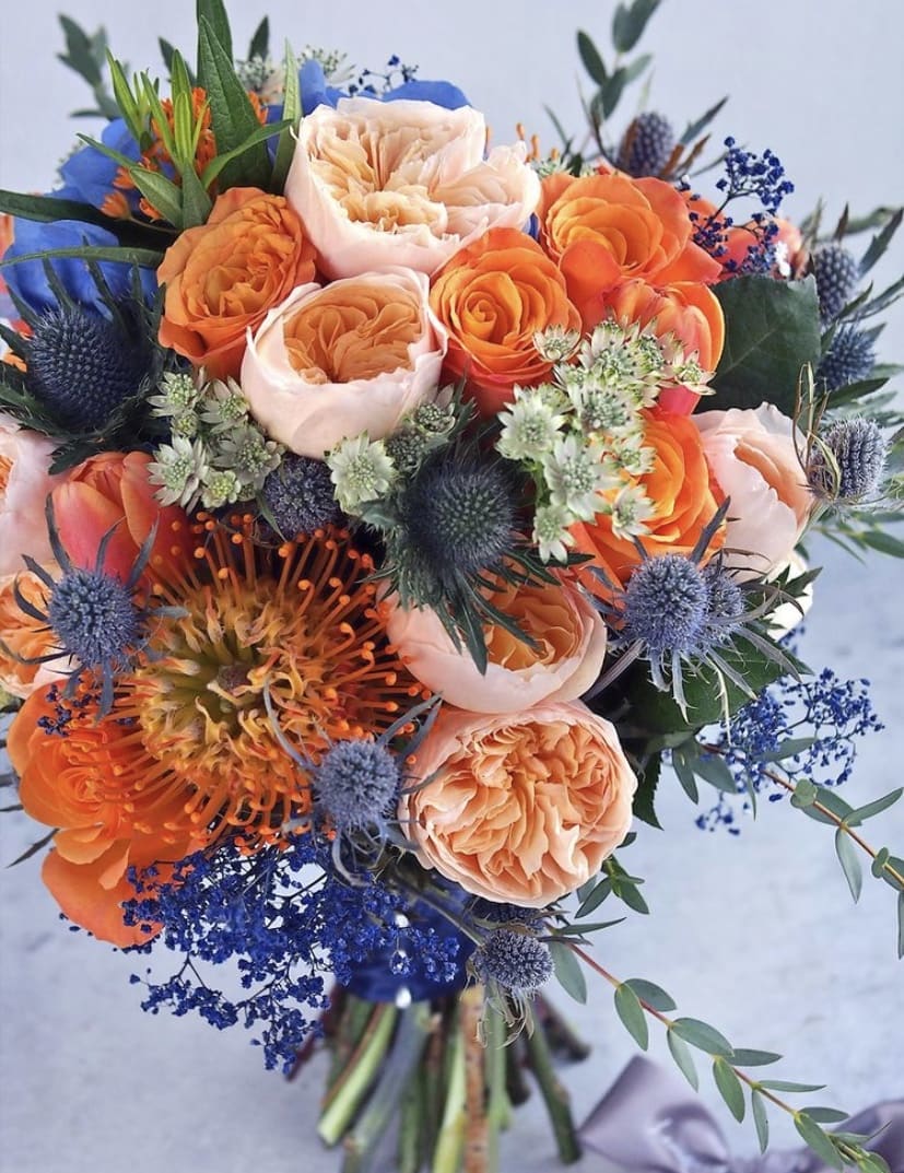 I Have an Orange Crush on You - I Have an Orange Crush on You Is chock full of premium orange flowers arranged in a low profile barnwood box. Only the freshest flowers are hand picked from the market so flowers may include garden roses, dahlia, pincushion, lilies, thistle and eucalyptus among others. Premium arrangement pictured above. 