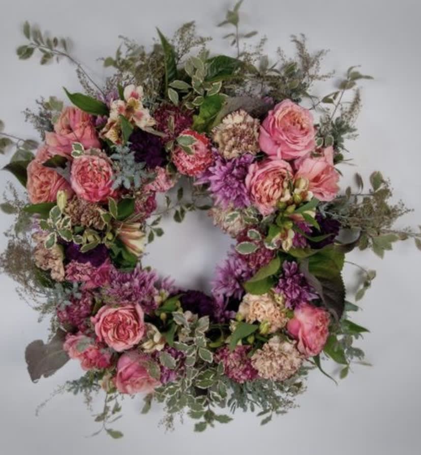 Pink and purple floral wreath with roses and mixed blooms