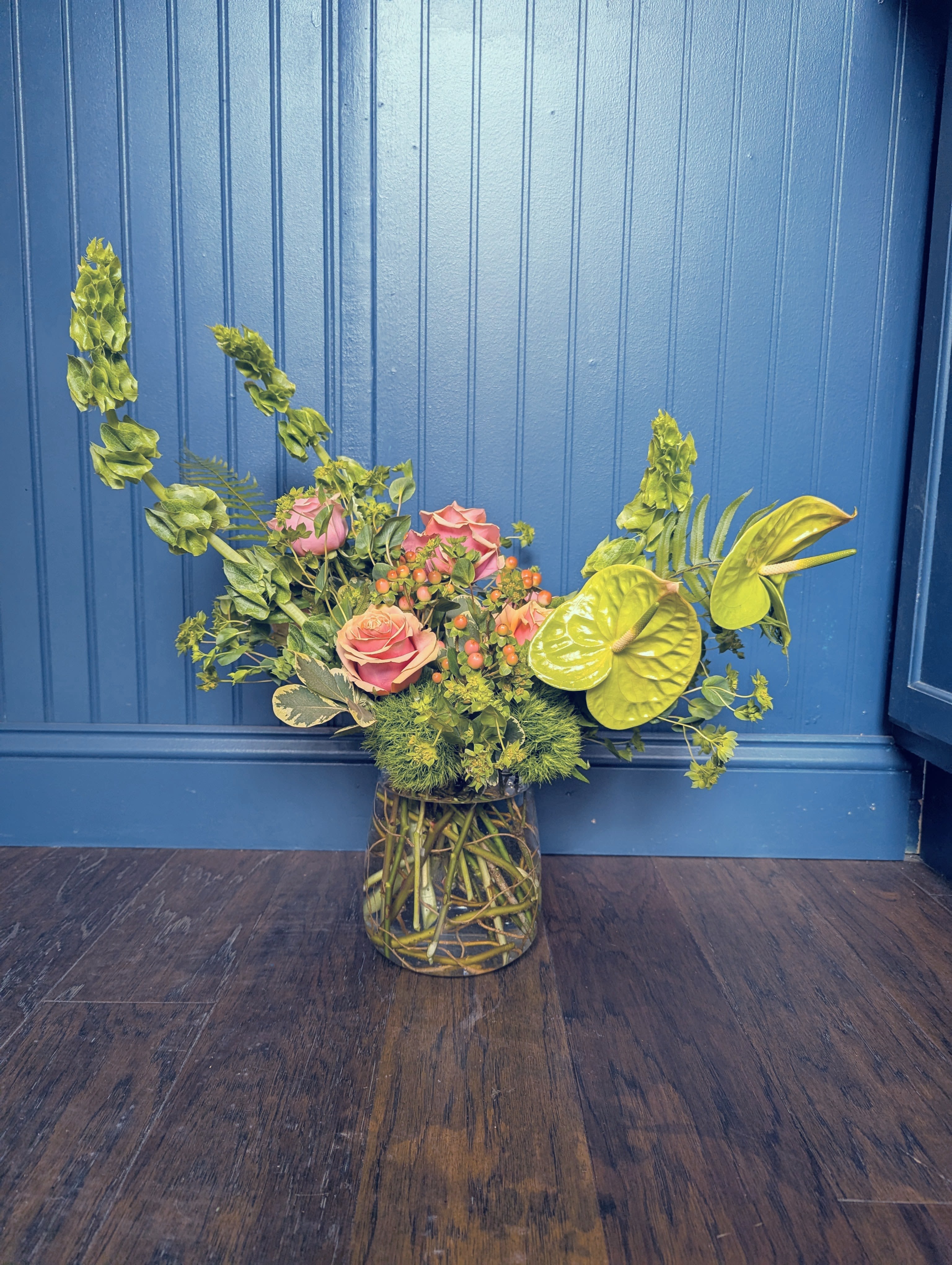 Lemonlime tangerine - Electric arrangement of Lime green and peach with a mix of traditional roses and tropical Anthurium. A fun and unique combo!