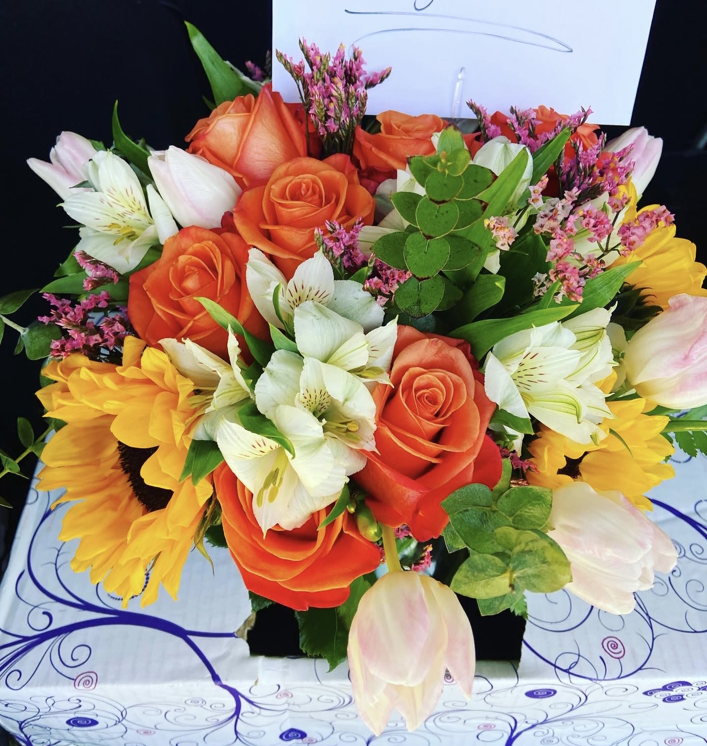  Designer's Choice Arrangement  - We work on vibes here, so you will most definitely be getting an amazingly beautiful, custom mixed arrangement, expertly designed from the heart. The pictures displayed here are examples of our Designer’s Choice Collection, it’s just to give you an idea of what we do here. You give us some details in regards to what the occasion is, and we get to work designing a custom arrangement made just for you. Standard arrangement will be delivered with standard greenery, and our finest seasonal blooms.  