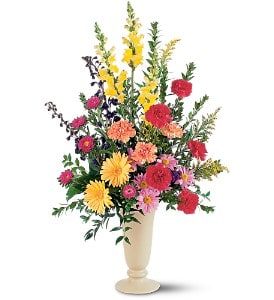  Vibrant Memorial  [TF217-1] - These vibrant orange, red, yellow and blue colors will celebrate the precious gift of life.  One design arrives with yellow snapdragons and gerberas, red and orange carnations, pink asters and lavender daisies in a tall ceramic vase.  Approximately 29" W x 37" H  Orientation: One-Sided      As Shown : TF217-1  