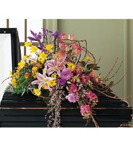  Eternal Spring Half-Couch Spray [TF197-1] - This spray with its mix of spring flowers will offer the kind of hope that spring always brings.  The half-couch casket spray features forsythia and a host of colorful spring bulb flowers including daffodils, iris, tulips and lilies.  Approximately 38" W x 50" H  Orientation: One-Sided      As Shown : TF197-1  