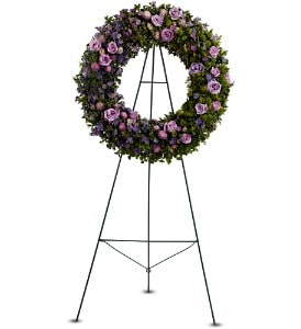  Heavenly Wreath [TFWEB537] - An artistic mix of green and lavender blooms, mingled with a generous selection of decorative greenery, creates a lovely wreath that will express your consideration and devotion at a funeral, wake or service.  A standing spray created from fresh flowers such as roses, Monte Cassino asters and button spray chrysanthemums, in shades of purple, lavender and green – accented with greenery – is delivered on an easel.  Approximately 26" (W) x 26" (H) (Dimensions do not include easel.)  Orientation: One-Sided      As Shown : TFWEB537  
