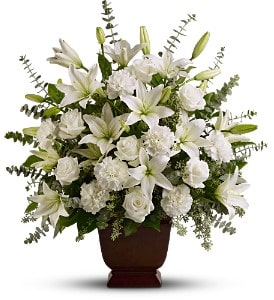 Sincere Serenity [TFWEB532] - A simple and elegant display of pure white blossoms such as roses, Asiatic lilies and carnations, presented in a classic urn, creates a serene and contemplative display. A traditional choice for any service or wake.  A mix of fresh white flowers such as Asiatic lilies, roses and carnations – accented with eucalyptus – is delivered in a Teleflora Noble Heritage urn.  Approximately 24" (W) x 26" (H)  Orientation: One-Sided      As Shown : TFWEB532 