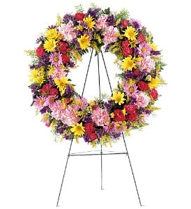  Eternity Wreath [TF189-8] - Show your love and support with this beautiful wreath of colorful mixed flowers. Its bright hues will lovingly grace the service.  Each wreath is decorated with pink carnations, lavender and yellow daisy chrysanthemums, plus colorful fillers and soft foliages. The wreath is delivered on an easel.  Approximately 24" D      As Shown : TF189-8  