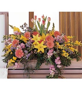 Blooming Glory Casket Spray [TF199-7] - This colorful half-couch spray blooms with bright flowers, promising that there's always hope and glory.  One half-couch casket spray is decorated with yellow lilies and snapdragons, pink gerberas, lavender stock, pink tulips and lavender waxflower.  Approximately 44" W x 37" H  Orientation: All-Around      As Shown : TF199-7  