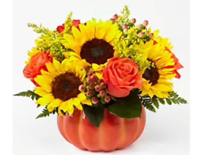 Sunflower and rose arrangement in a pumpkin-shaped container
