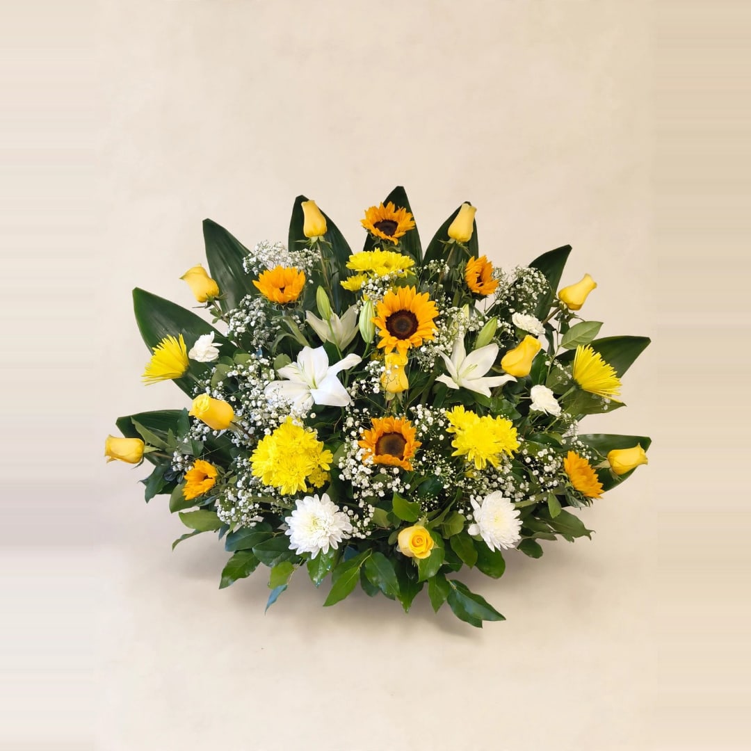 Yellow and white mixed flower arrangement with sunflowers and roses