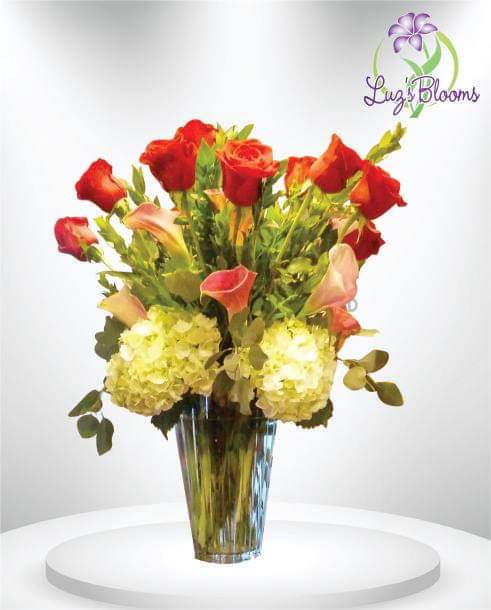 Cheery Moments - Brighten someone's day with this cheerful bouquet. This arrangement includes roses and hydrangea and is the perfect gift for a birthday, to celebrate new beginnings, or to cheer someone up.