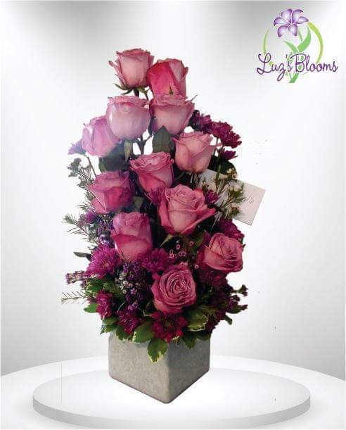 Lavender Love - An explosion lavender colors in a tall rose centric arrangement
