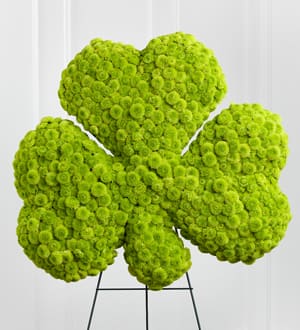 Bright green floral arrangement shaped like a flower on a stand
