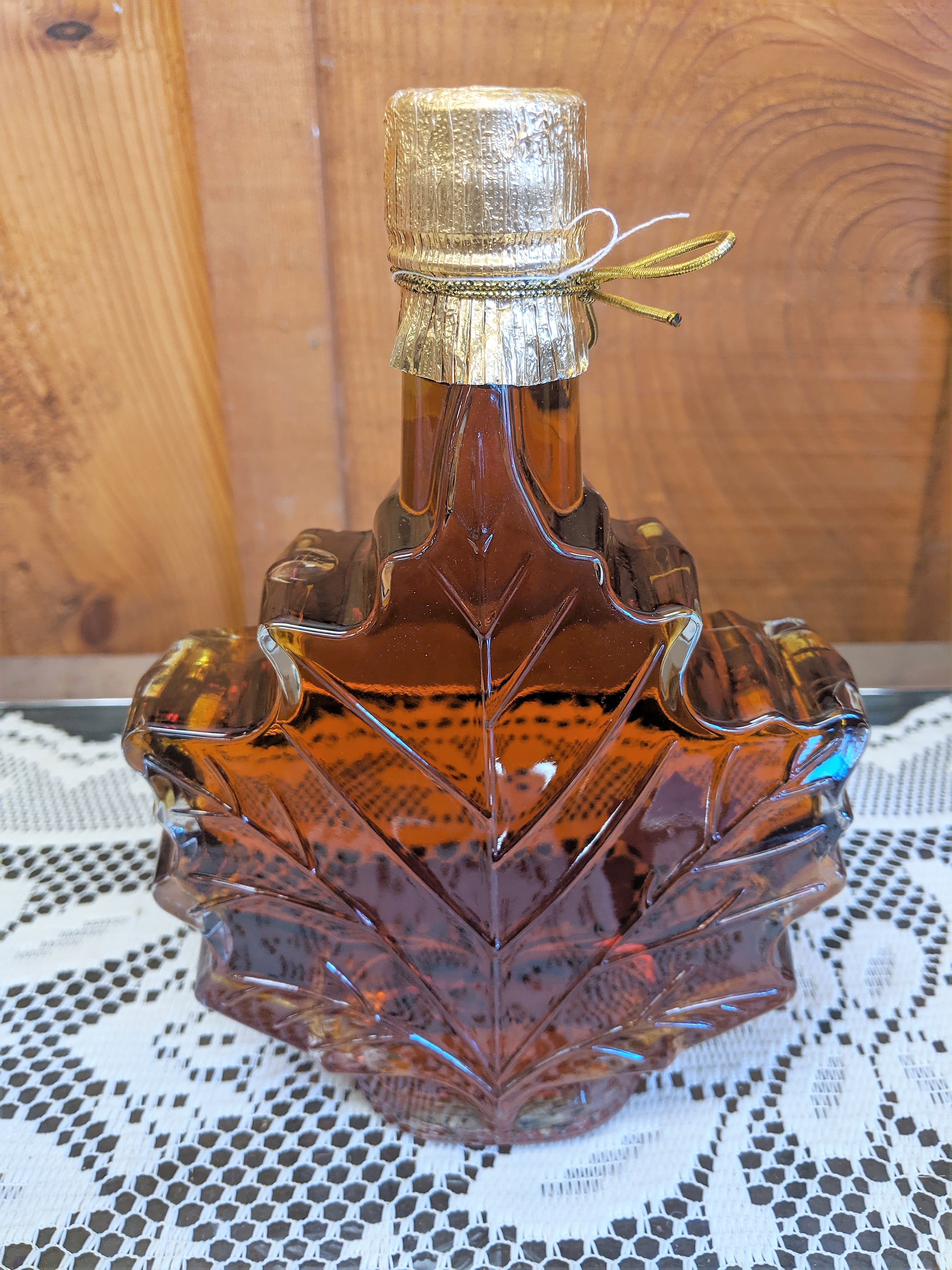 Local Maple Syrup Medium Size  - Locally sourced Maple Syrup in a beautiful glass maple leaf container. This is a great gift. Add on to a flower arrangement or we can ship it on it's own. 