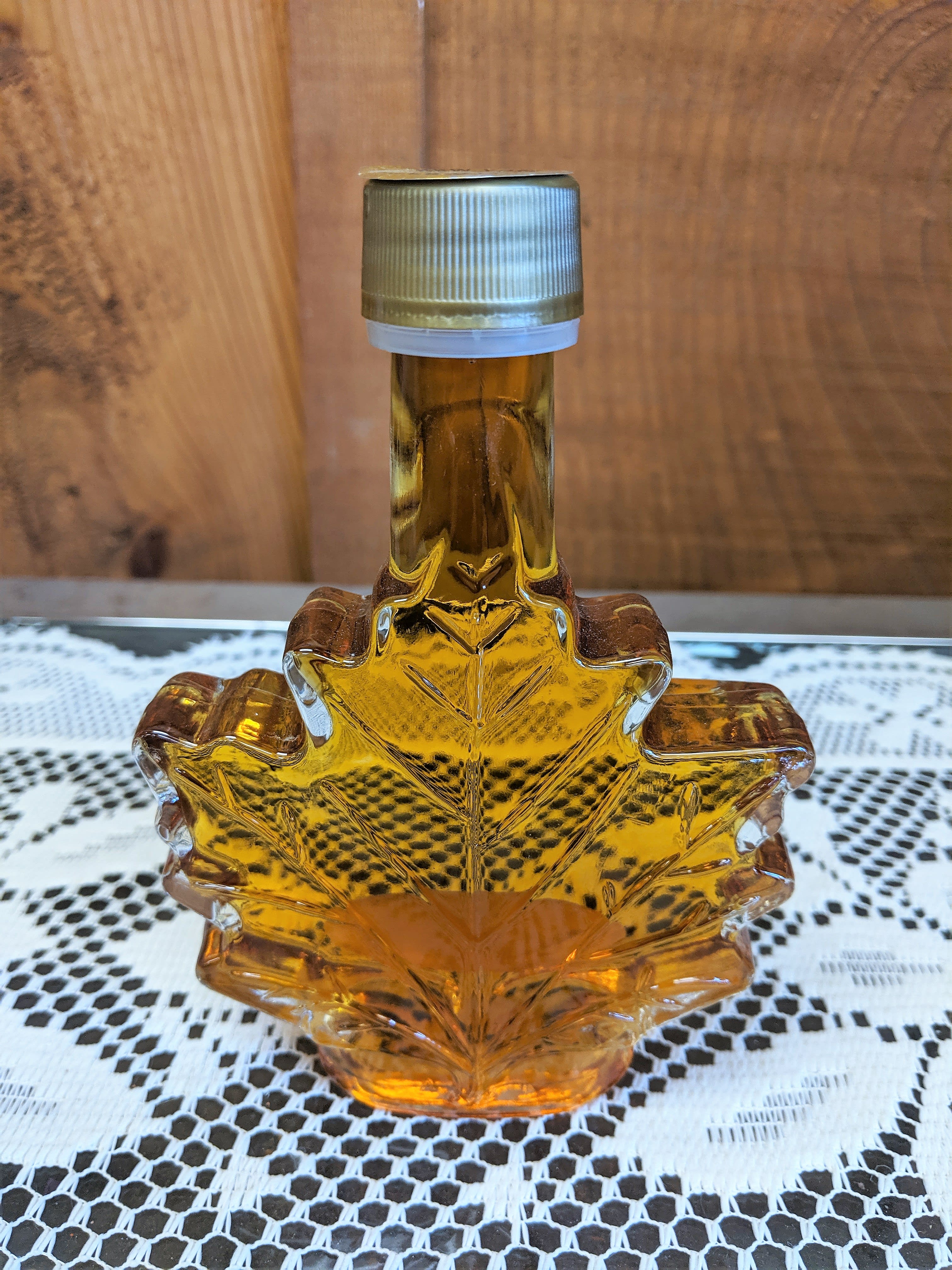 Local Maple Syrup Small Size - Locally sourced maple syrup in a reusable glass maple leaf jar. Perfect for adding to any floral arrangement or can be delivered on it's own. It is also a great addition to any gift or basket. 