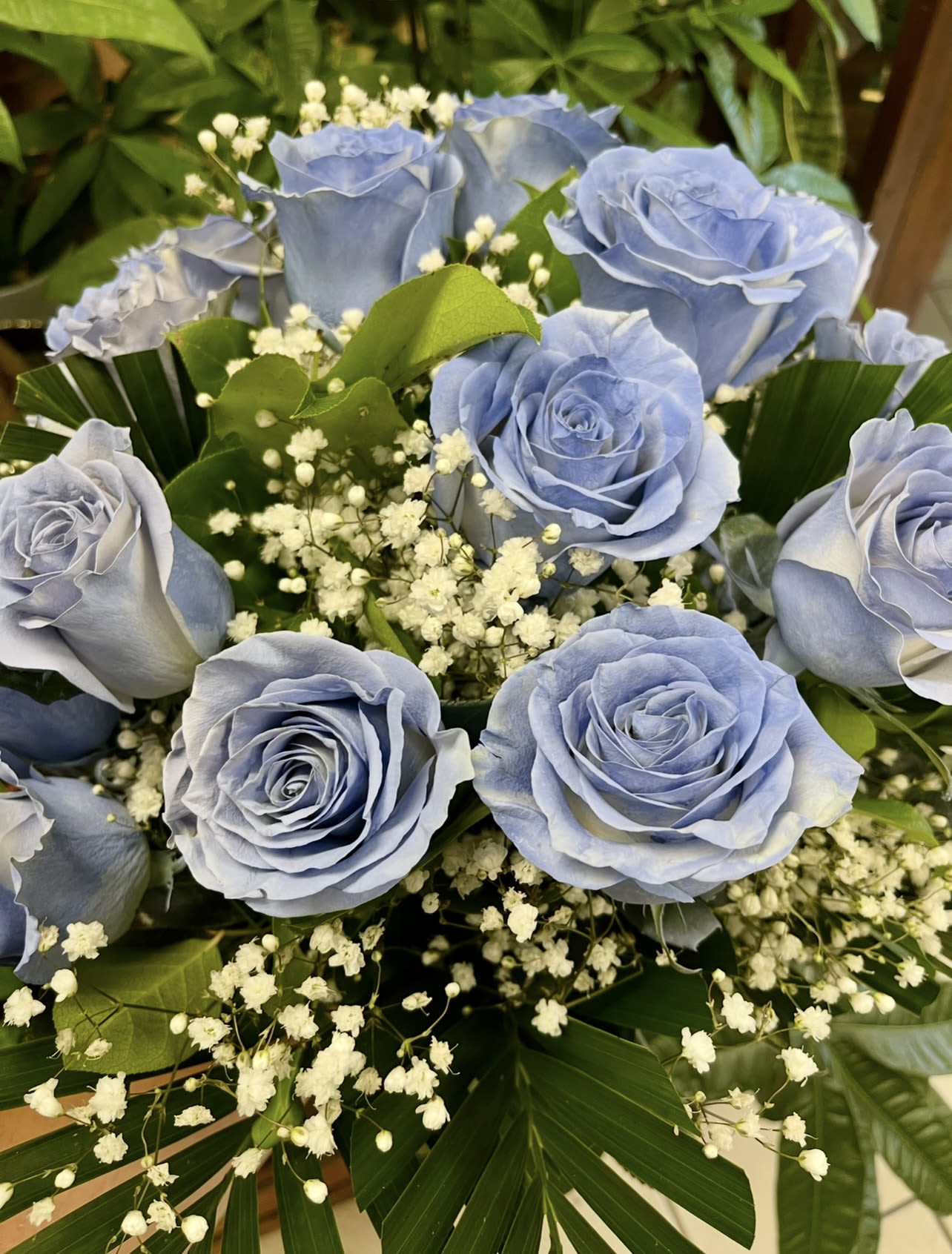 Bouquet of pale blue roses with white baby's breath