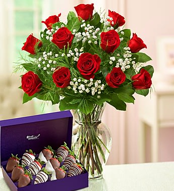 Romantic Gesture - Product ID: 95226  Long-stem red roses and romantic chocolate dipped strawberries are just the gifts for the one you can trust, the one you can turn to, the one who loves you above all else. Make the ultimate romantic gesture with this beautiful combination! One dozen of the freshest long-stem roses, artistically arranged by our expert florists with fresh gypsophila in a 11"H classic glass vase Measures approximately 22"H x 15"D Our florists hand-design each arrangement, so colors, varieties, and container may vary due to local availability Hand-dipped strawberries decorated with white and milk chocolaty swirls Available in counts of 12 strawberries Berries arrive in a box with a romantic red ribbon Delivered fresh to their door with Same-Day Delivery