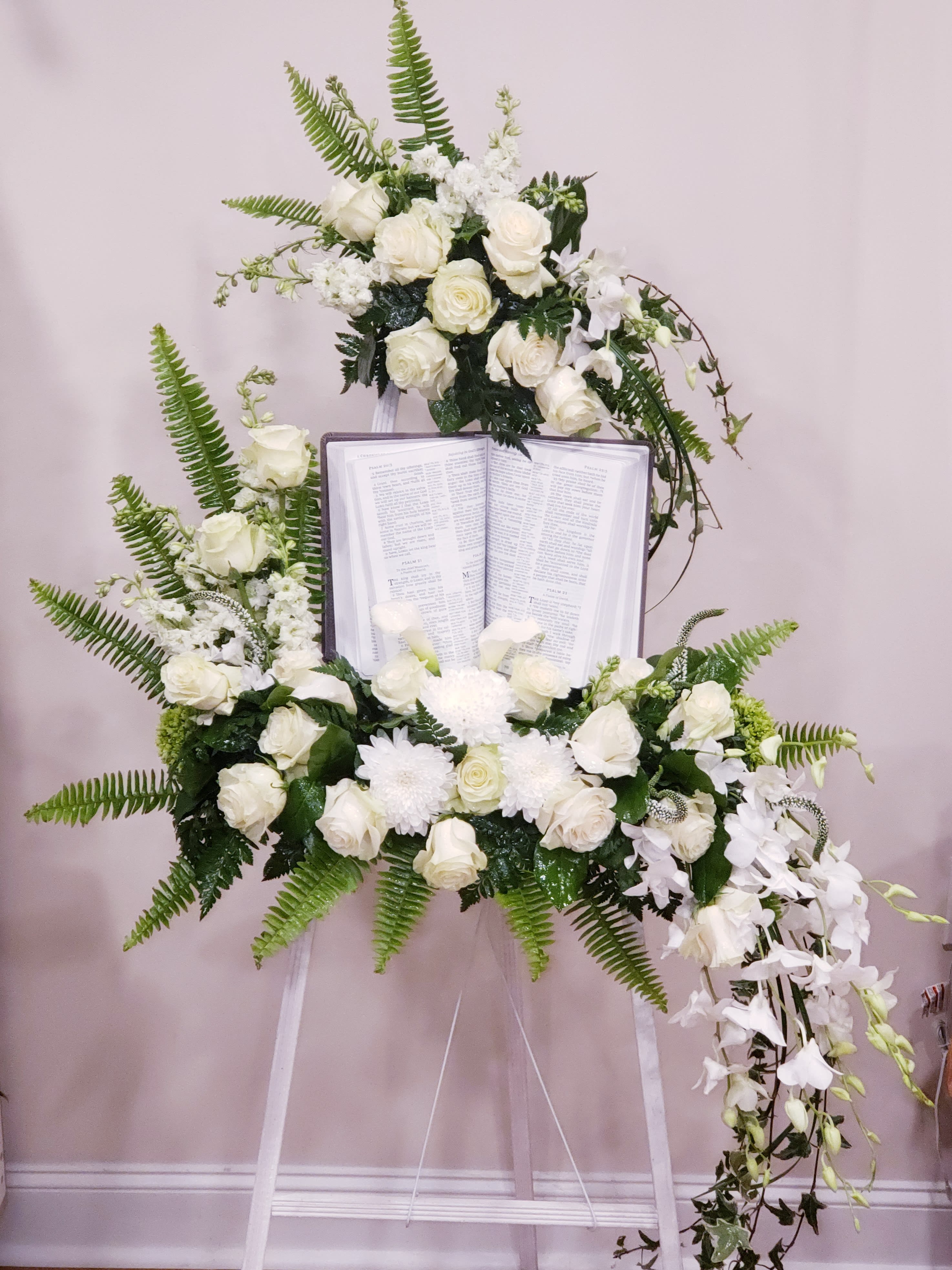 White easel spray with Bible  - Beautiful white blooms easel spray with Bible. 