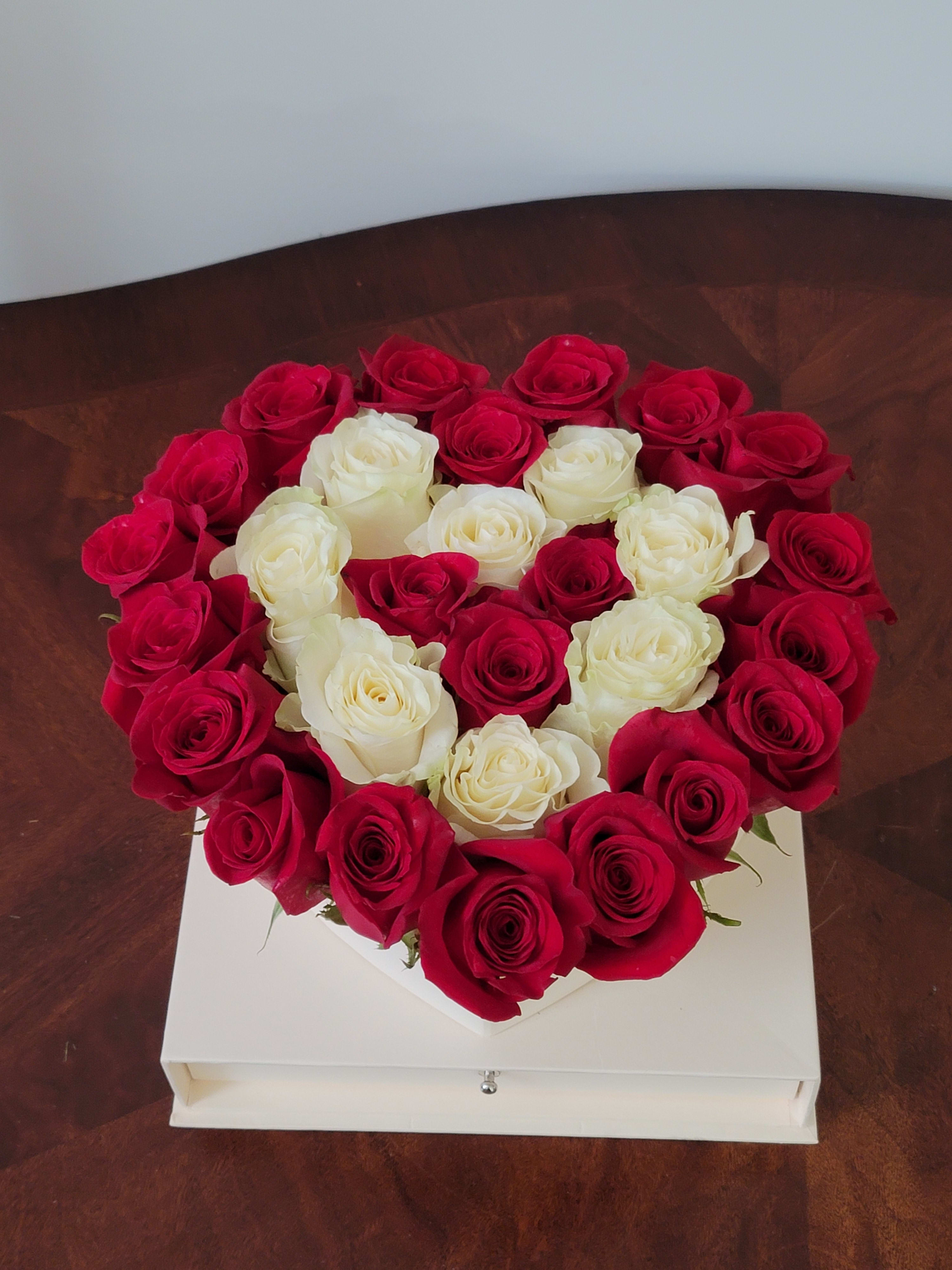 Heart-shaped box of red and white roses