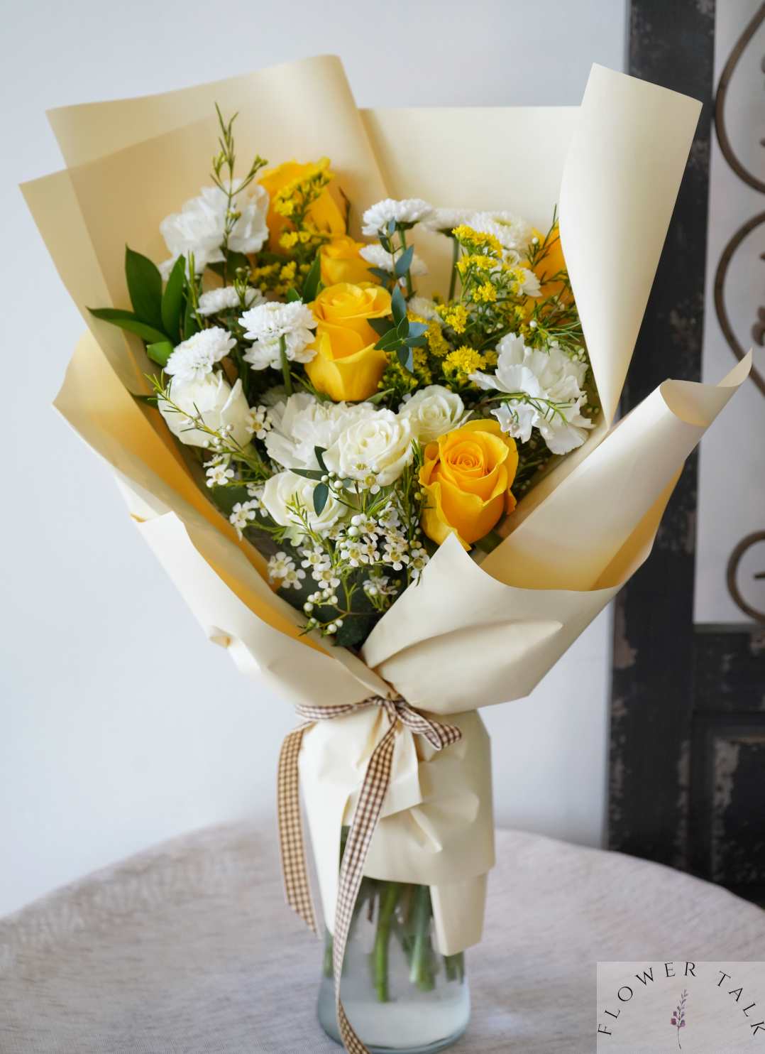 Belle Hand Bouquet (Vase Not Included) - A radiant blend of sunny yellow roses, delicate white spray roses, and soft carnations, perfect for brightening any day.