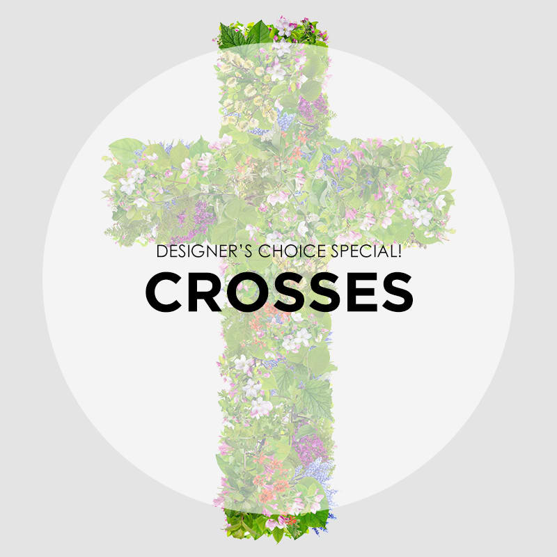 Floral cross arrangement with mixed pink, white, and purple blooms