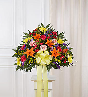 Heartfelt Sympathies Bright Standing Basket - Product ID: 91389   During times of great sorrow, a message of care and hope is always important and appreciated. Our expert florists create this exquisite standing basket, filled with a colorful array of roses, lilies, mums and more, for a touching tribute thatâs appropriate for family, friends, or coworkers, letting them know that brighter days are ahead. Standing basket arrangement of fresh, brightly colored roses, lilies, mums, mini carnations, statice and more Appropriate for family, friends or business associates to send directly to the funeral home Our florists use only the freshest flowers available, so colors and varieties may vary Large measures approximately 38"H x 38"L without stand Medium measures approximately 32"H x 36"L without stand Small measures approximately 30"H x 34"L without stand Stand may not be available in all areas