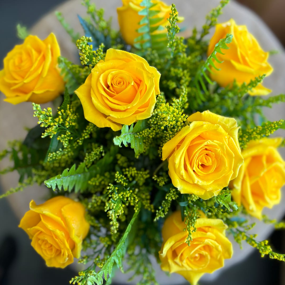 Bouquet of yellow roses with green filler flowers