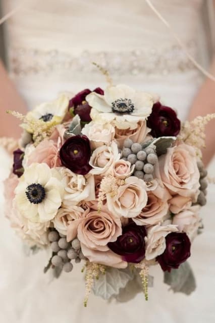 Bouquet of blush roses and dark burgundy flowers with white anemones
