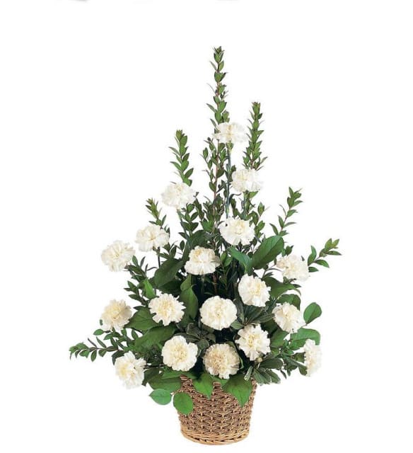 White carnation arrangement in a woven basket