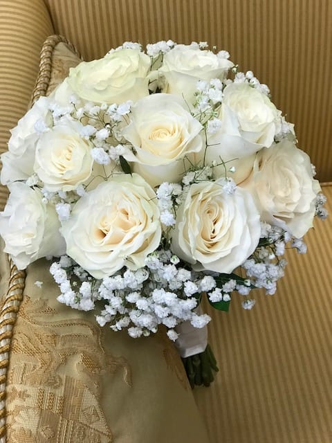 Bouquet of white roses with baby's breath