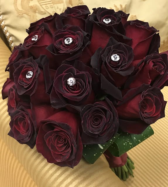 Bouquet of dark red roses with jeweled centers