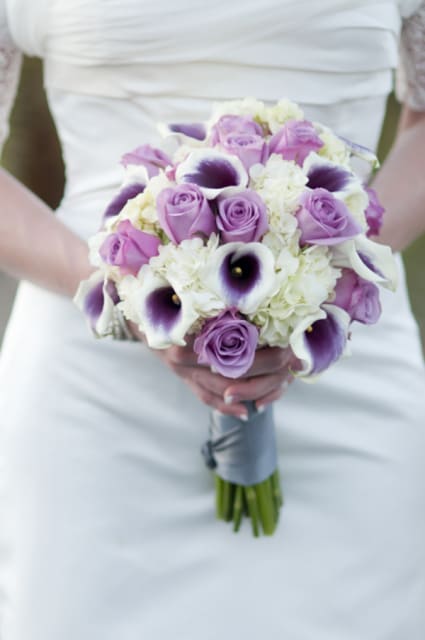 Bridal bouquet of lavender roses, white hydrangeas, and purple calla lilies