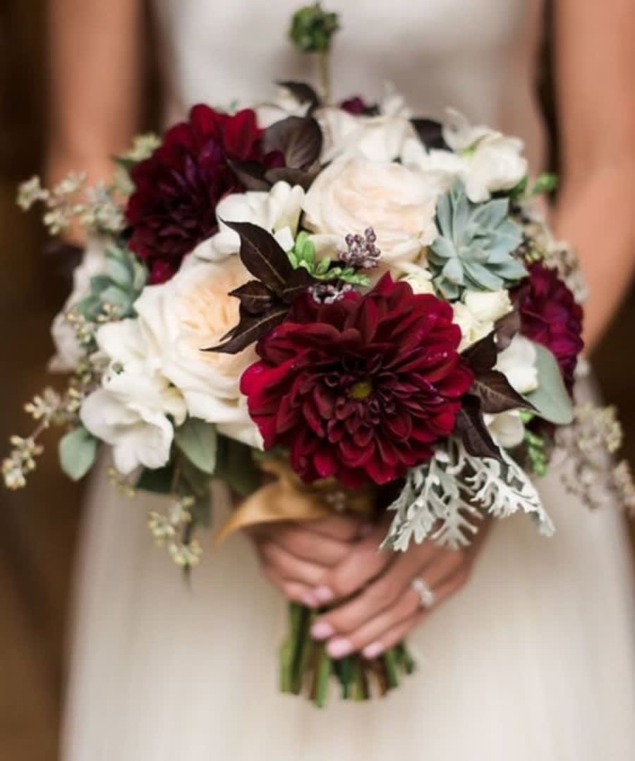 Bridal bouquet of burgundy, white, and blush flowers