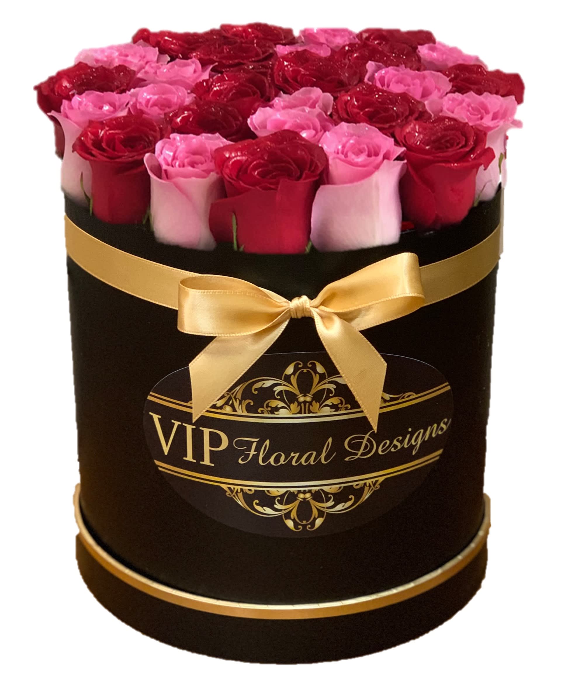 Round box of red and pink roses with a gold ribbon