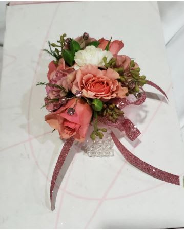 Pink and white rose boutonniere with glitter ribbon