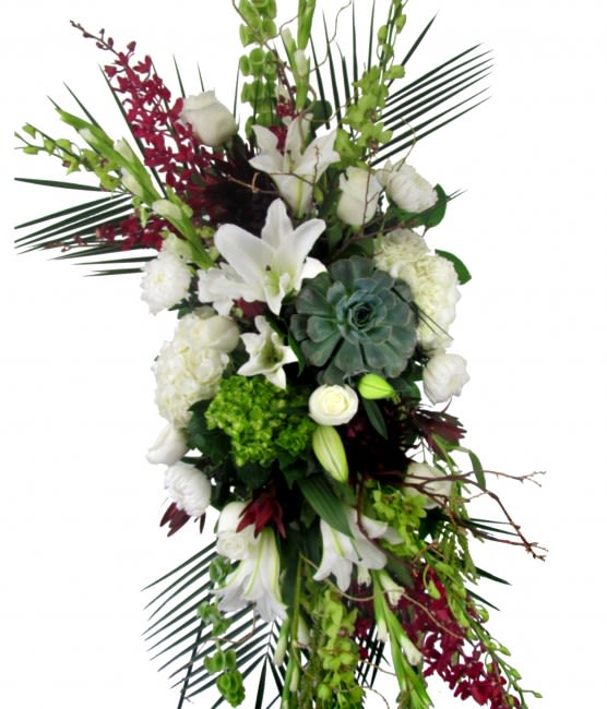 Tall floral spray with white lilies, roses, and green accents