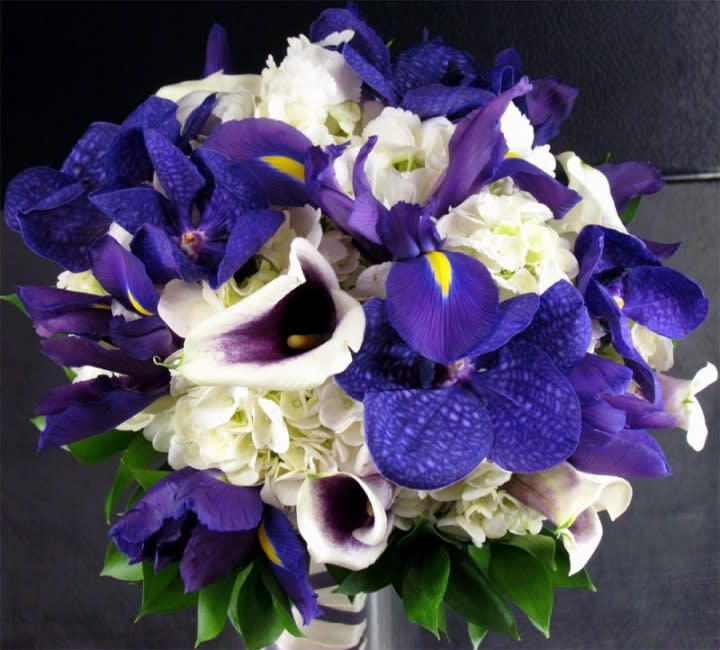 Bouquet of purple irises, white hydrangeas, and white calla lilies