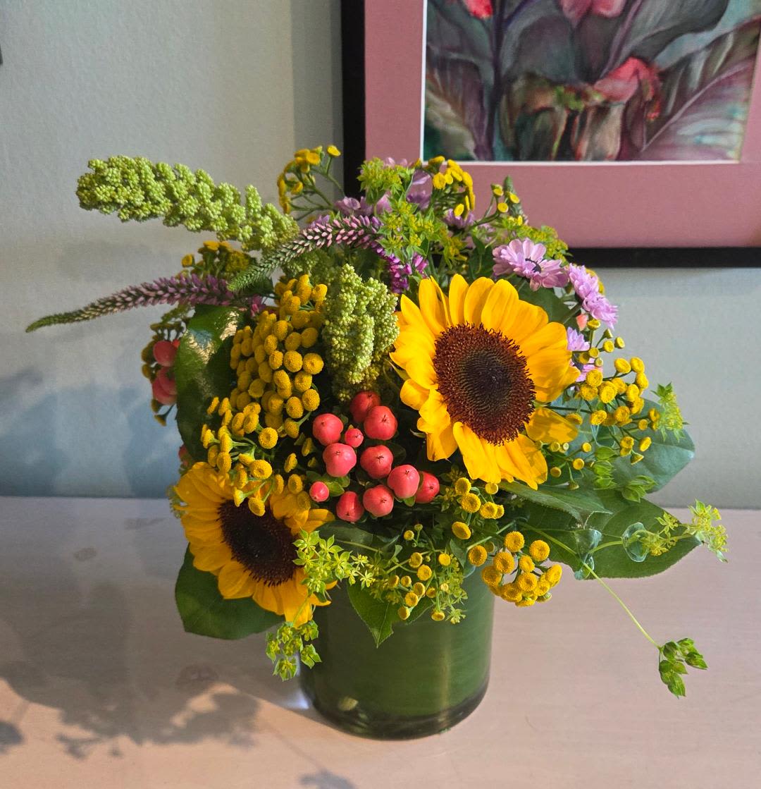 Fields of Wildflowers - Bright organic blooms delivered fresh from Lancaster Pennsylvania. We select a variety for you that will always include three sunflowers with local wildflowers.