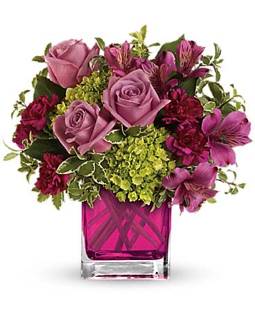 Splendid Surprise - Sweet as can be. This lovely arrangement includes green miniature hydrangea and lavender roses arranged in our adorable fuchsia cube.  Green miniature hydrangea, lavender roses, purple alstroemeria and maroon miniature carnations accented with greens. Delivered in Teleflora's glass fuchsia cube.
