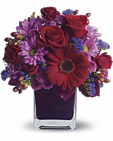 It's My Party  - The only crying that this plum party arrangement might inspire are tears of joy! So fabulous. So fun. So fall with its jewel-toned modern cube that's chock full of gorgeous red, purple and perfect flowers.  Red roses and gerberas, dark red spray roses, lavender chrysanthemums, purple statice and red hypericum are beautifully arranged in a plum cube vase. So get the party started!  Approximately 10 1/2" W x 12" H