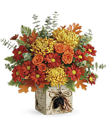 Wild Autumn Bouquet - Celebrate fall's wild beauty with this rich autumnal bouquet! Presented in a rustic cube vase with unique birch tree finish, it's adorned with twine and stamped metal leaf charms, a true gift of the season!  This wildly beautiful bouquet includes orange spray roses, bronze disbud chrysanthemums, red daisy spray chrysanthemums, spiral eucalyptus, and transparent orange oak leaves. Delivered in a Wild Autumn cube.