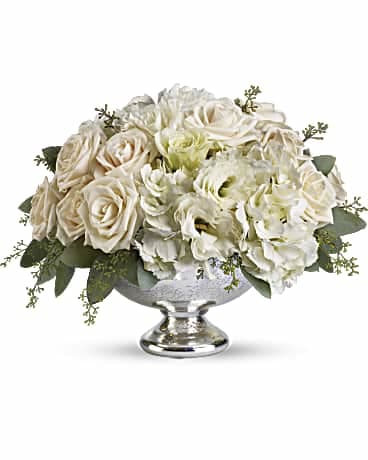 Park Avenue Centerpiece - Treat your guests to Park Avenue elegance with this dazzling arrangement of crème roses, white hydrangea and white lisianthus presented in a brilliant Mercury Glass Bowl. It's a lovely choice for any special occasion, from weddings to anniversaries.  A beautiful Mercury Glass Bowl presents a soft mix of crème roses, white hydrangea and white lisianthus accented with seeded eucalyptus.  Approximately 13 1/2" W x 10 1/4" H